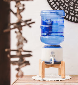 Beautiful Timber Stand with hi vibe ceramic and water bottle on top.